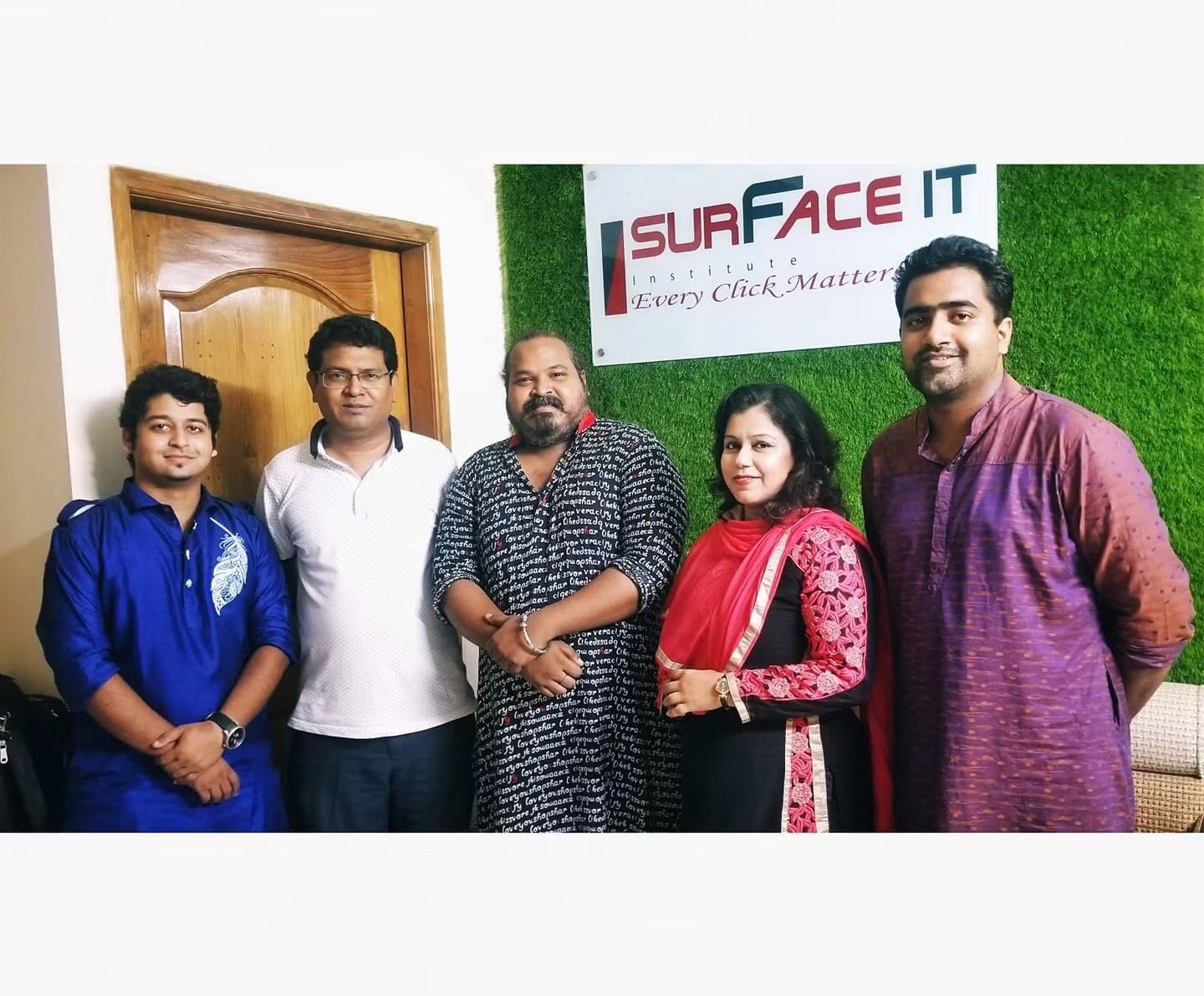 Five people standing beneath a sign reading Surface IT Institute, Every Click Matters.